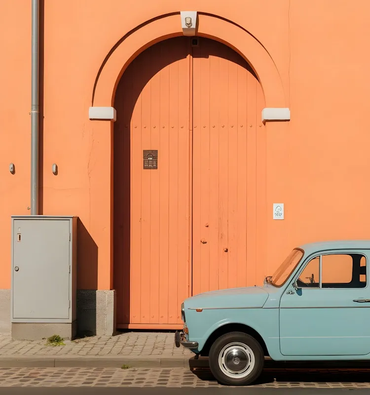 Sunset over a beach road with a classic VW van and a distant figure